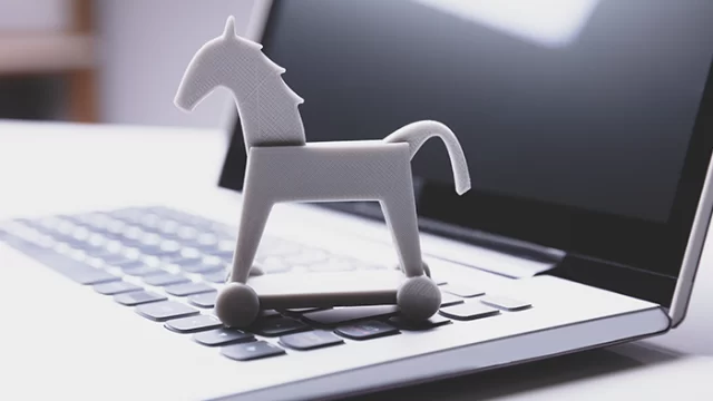 Bilgisayar ekranında trojen virüsü uyarısı görünen bir görsel.